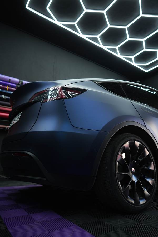 Satin blue wrap on a Tesla